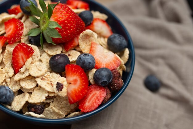 Healthy spelt breakfast with strawberries and blueberries