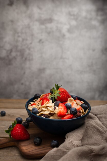 Healthy spelt breakfast with strawberries and blueberries