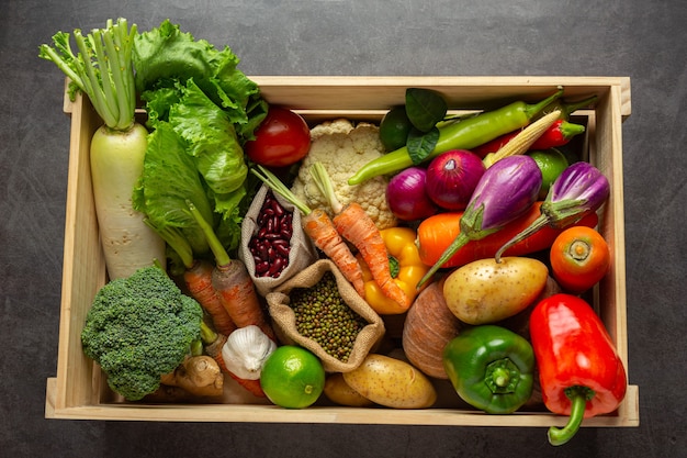 Healthy vegetables on old dark background