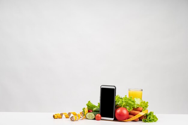 Healthy vegetables and phone copy space
