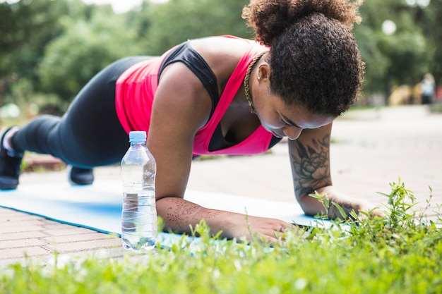 Healthy woman doing exercise outdoors