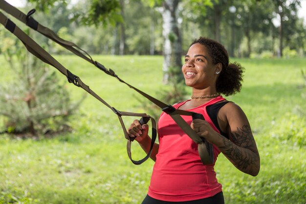 Healthy woman doing exercise outdoors