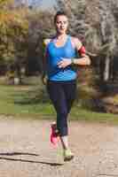 Free photo healthy young woman running in the park