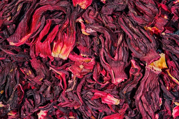 Heap of dry hibiscus tea Background tea dried hibiscus flowers top view