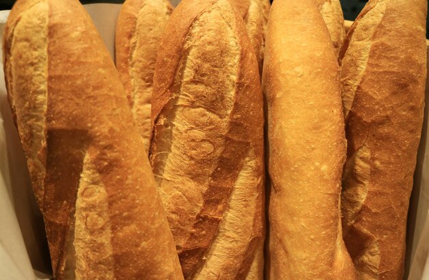 Heap of french baguette loaves in a bakery