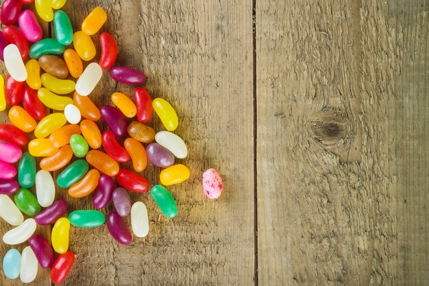 Heap of jelly beans on wooden background