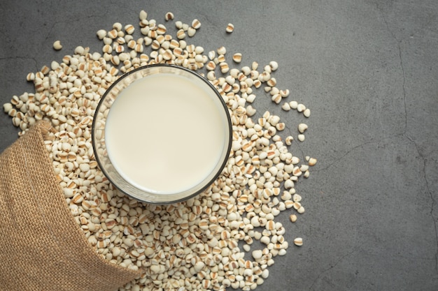 Heap of millet seeds on dark background