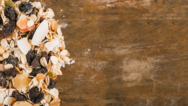 Heap of muesli on wooden tabletop