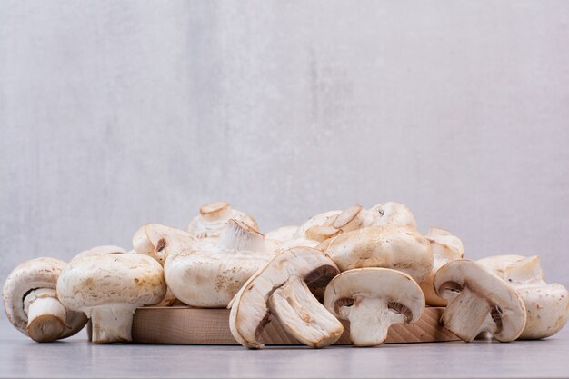 Heap of ripe mushrooms on stone surface