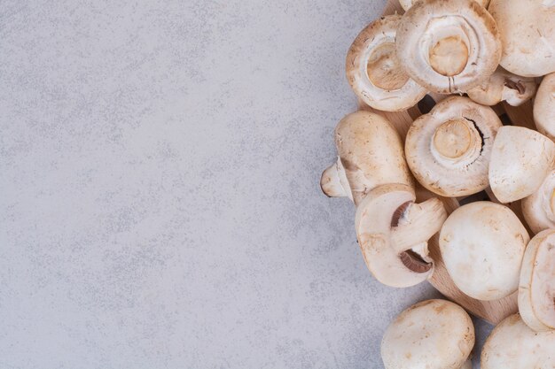 Heap of ripe mushrooms on stone surface