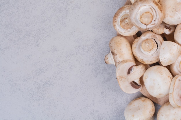 Heap of ripe mushrooms on stone surface