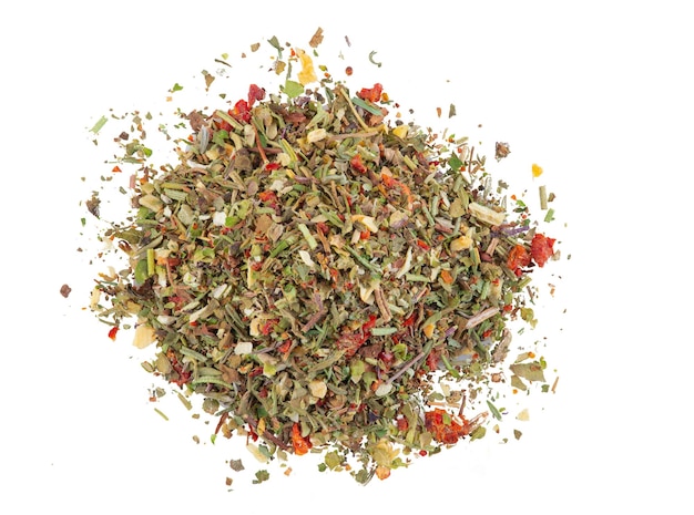 Heap of some chopped, mixed herbs isolated on white background with copy space for text or images. Spices. Food, cooking, restaurant, packaging concept. Frame composition, close-up, top view.