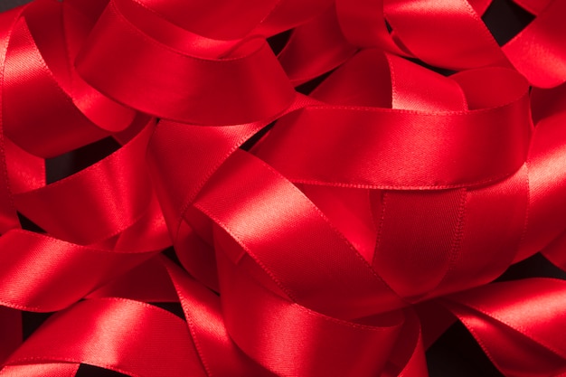 Heap of tangled red ribbon