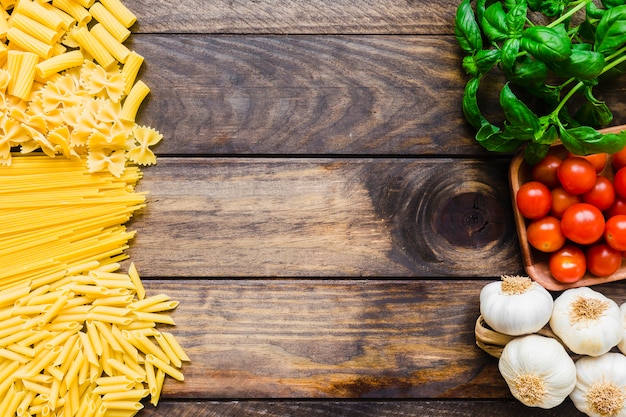 Heaps of pasta and vegetables with herbs