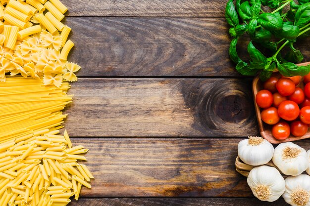 Heaps of pasta and vegetables with herbs