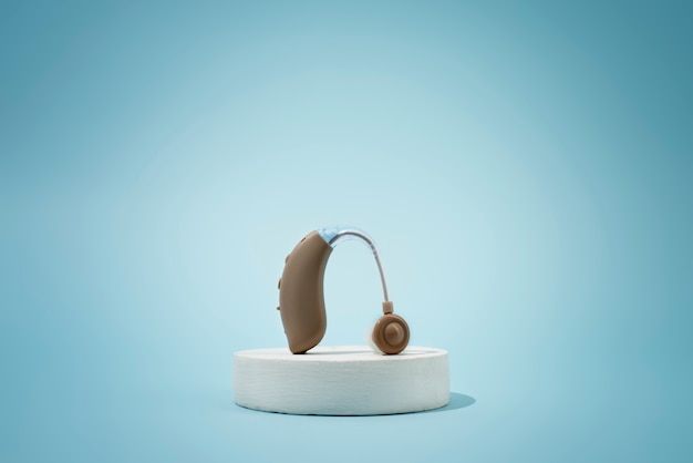 Free photo hearing aids on white podium