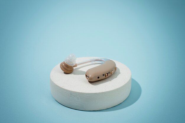 Hearing aids with blue background high angle