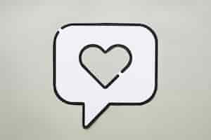 Free photo heart in bubble speech icon on table