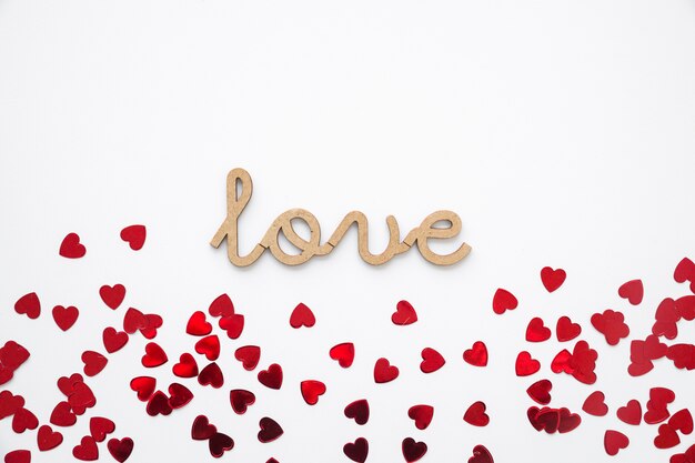 heart confetti near love writing