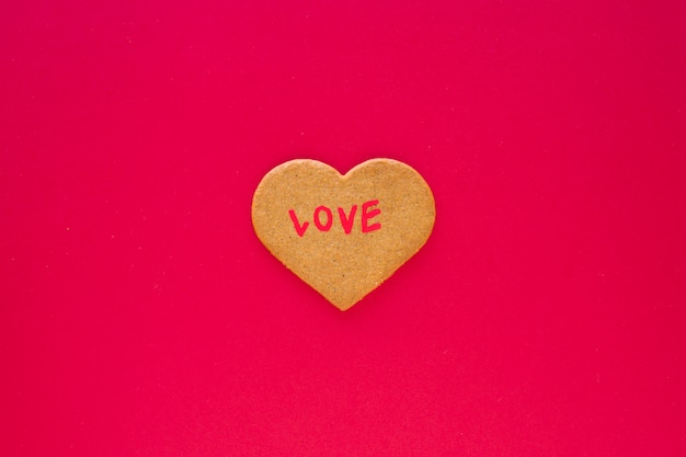 Heart cookie with Love inscription 