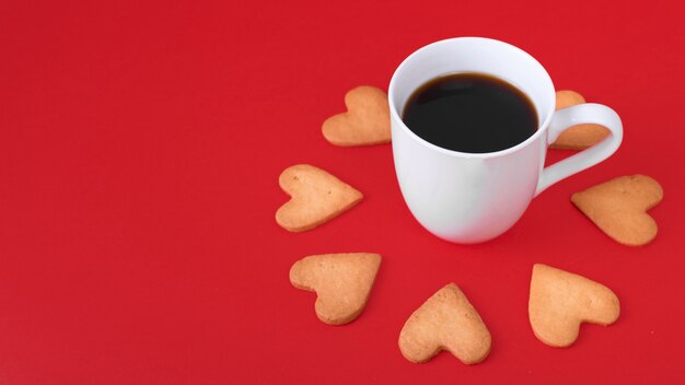 Heart cookies with white coffee cup on table