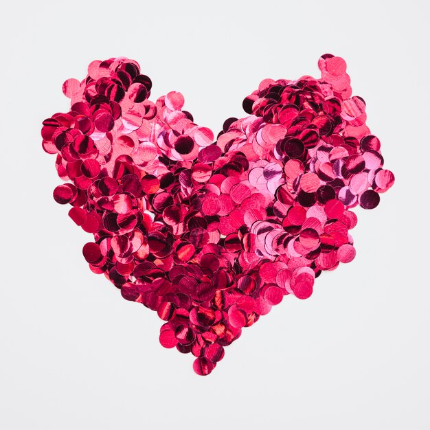 Heart design made of pink confetti