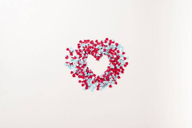 Heart from blue and red confetti