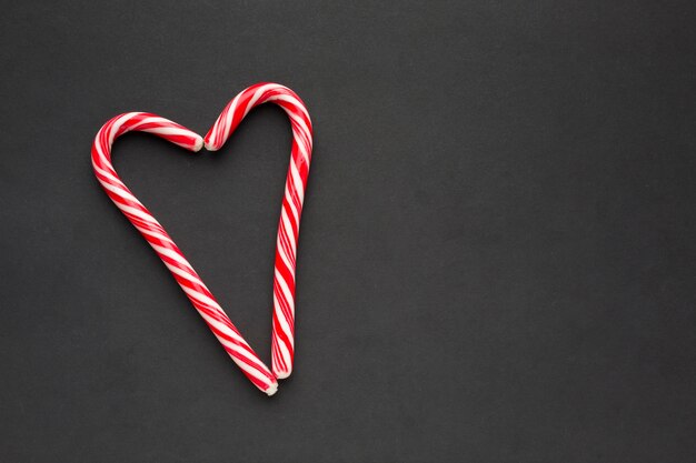 Heart made of candy canes with copy space