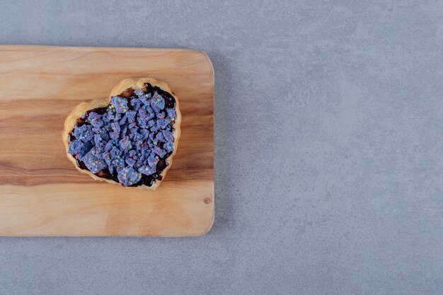 Heart shape biscuti on wooden board