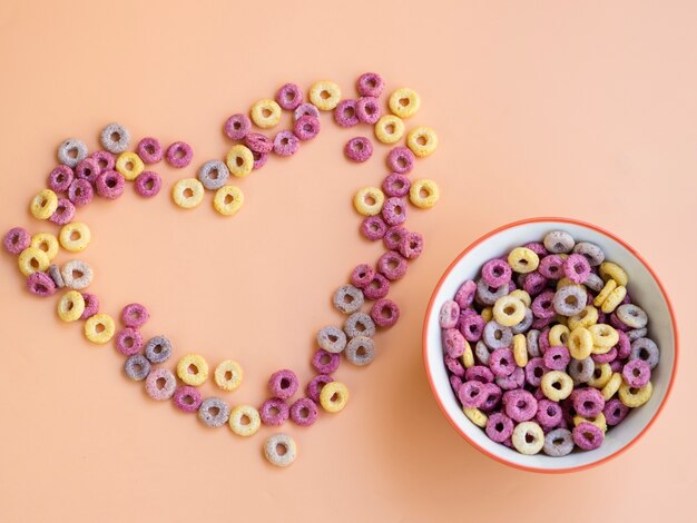 heart shape made with cereals and bowl