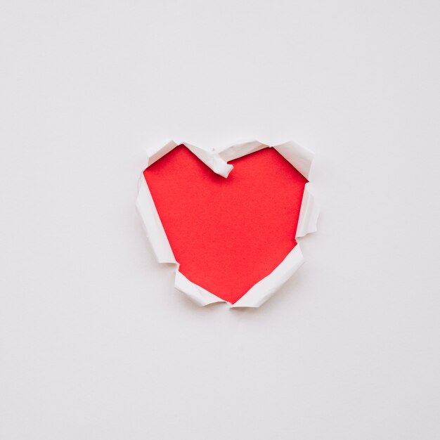 Heart shape on torn paper