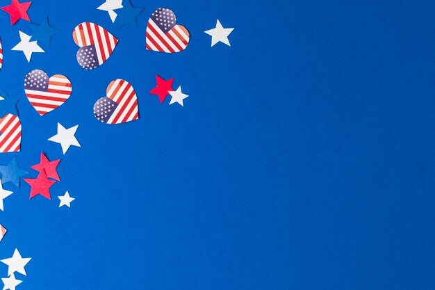 Heart shape usa flags and stars on blue background