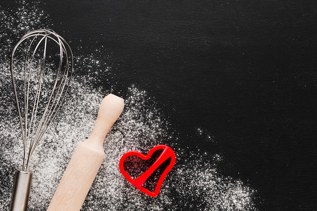 Heart shape with rolling pin and flour