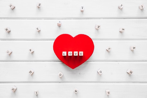 Heart-shaped box with love writing amidst letters