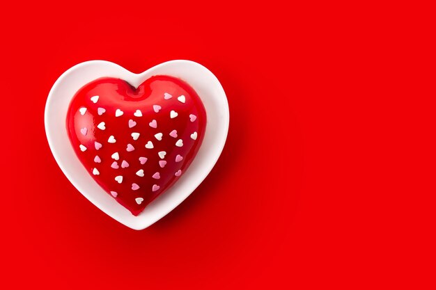 Heart shaped cake for Valentine's Day or mother's day on red background