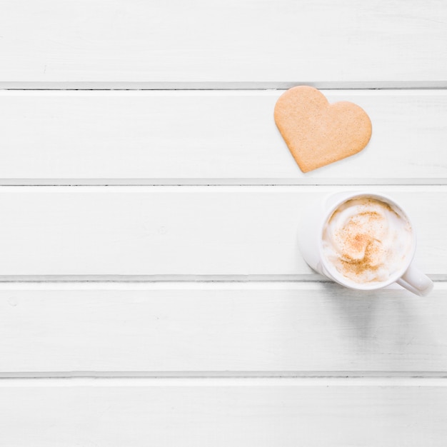 Heart-shaped cookie and coffee