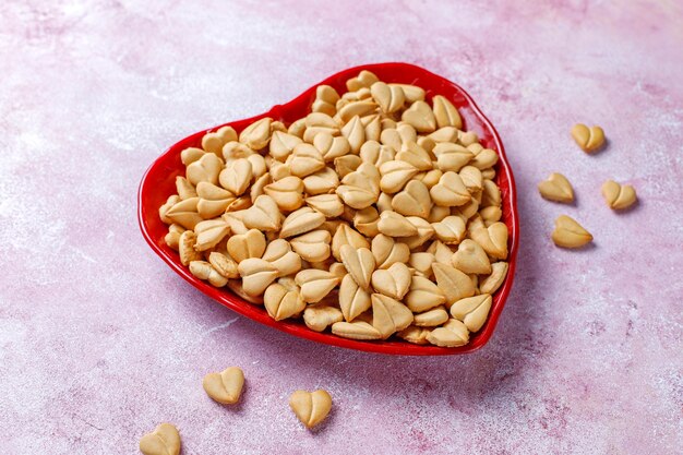 Heart shaped crackers in a heart shaped bowl.