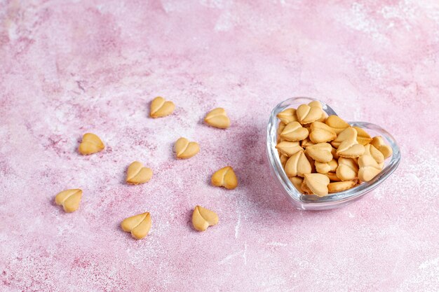 Heart shaped crackers in a heart shaped bowl.