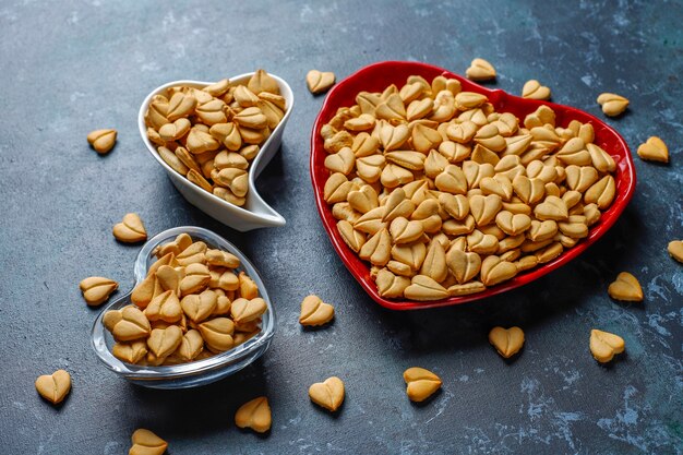 Heart shaped crackers in a heart shaped bowl.