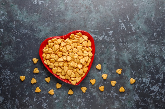 Heart shaped crackers in a heart shaped bowl.