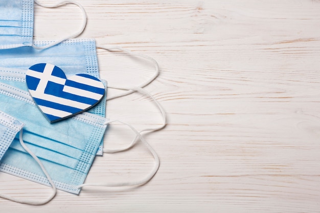 Heart shaped greece flag with face masks