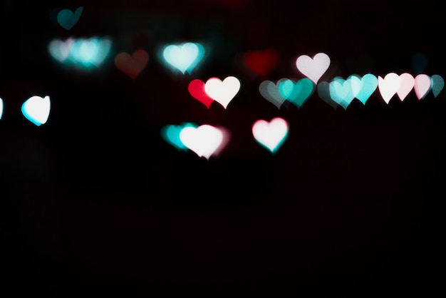 Free photo heart shaped neon lights background