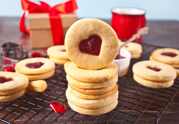 Heart shaped traditional linzer cookies with strawberry jam. valentine s day concept.