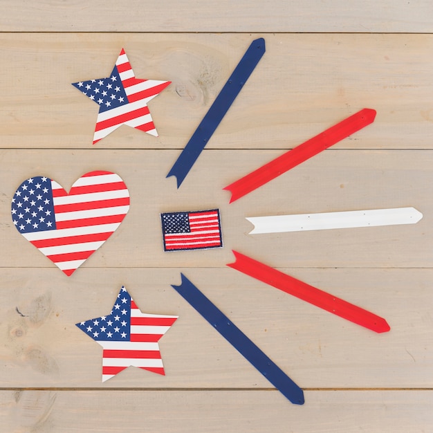 Free photo heart and stars in american flag color and stripes on wooden surface