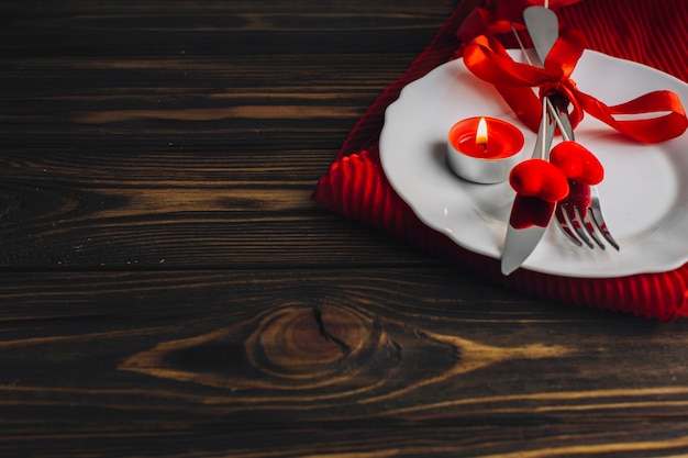 Heart sticks and utensils on plate