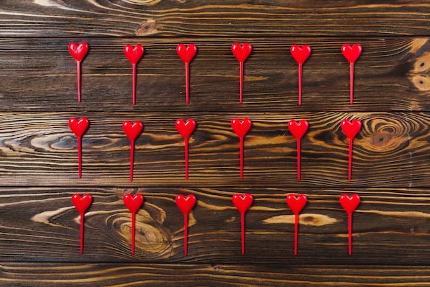 Heart sticks on wooden background