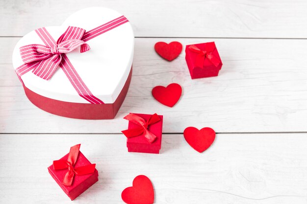 Hearts and gift boxes on wooden tabletop