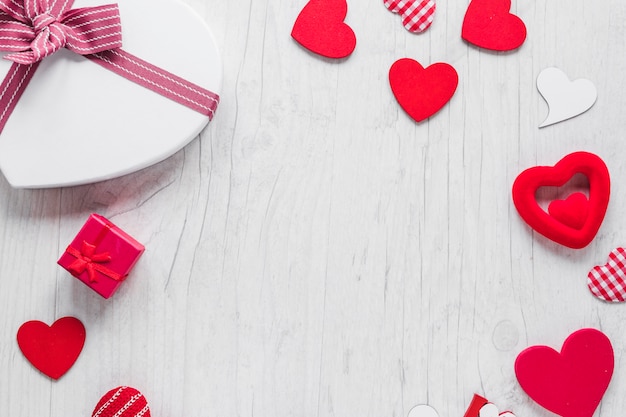 Hearts and gifts on timber background