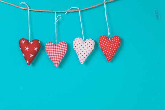 Hearts hanging on a rope on a blue background