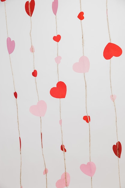 hearts laid on ropes on a white background